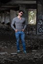 Strong Man in Grey Shirt Background Graffiti Wall Royalty Free Stock Photo