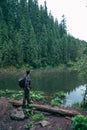 strong man hiker looking at mountain lake Royalty Free Stock Photo