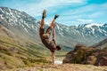 Man making acrobatic trick on hand upside down