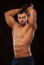 Strong man making exercises on triceps with a dumbbell. Close up shot training hands. Fitness Model showing his Torso Royalty Free Stock Photo