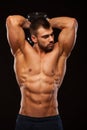 Strong man making exercises on triceps with a dumbbell. Close up shot training hands. Fitness Model showing his Torso Royalty Free Stock Photo