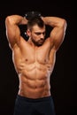 Strong man making exercises on triceps with a dumbbell. Close up shot training hands. Fitness Model showing his Torso Royalty Free Stock Photo