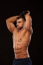 Strong man making exercises on triceps with a dumbbell. Close up shot training hands. Fitness Model showing his Torso Royalty Free Stock Photo