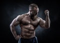 Strong man with perfect abs, shoulders, biceps, triceps and chest Royalty Free Stock Photo