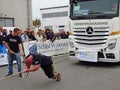 A strong man pulls a big truck Royalty Free Stock Photo