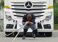 A strong man pulls a big truck Royalty Free Stock Photo