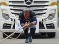 A strong man pulls a big truck Royalty Free Stock Photo