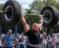 Strong man raises a heavy barbell. Weightlifting Royalty Free Stock Photo