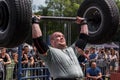 Strong man raises a heavy barbell. Weightlifting Royalty Free Stock Photo