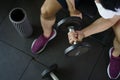 Strong man sitting and workout lifting dumbbell for exercise in Royalty Free Stock Photo