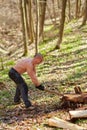 Strong man splitting logs