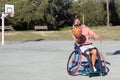 Strong man in sports wheelchair playing basketball Royalty Free Stock Photo