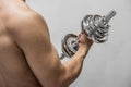 Strong man working out with dumbbell