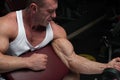 Strong mature man working out in the gym Royalty Free Stock Photo