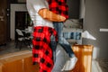 Strong man carrying his woman in the room with boxes Royalty Free Stock Photo