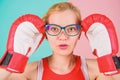 Strong mentally and physically. Smart and strong. Woman boxing gloves adjust eyeglasses. Win with strength or intellect