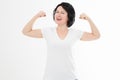 Strong middle age woman showing her muscularity and looking at camera isolated on white. Copy space and blank template t shirt