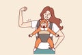 Strong mother with newborn in baby carrier shows biceps demonstrating confidence in future of child