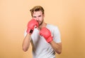 Strong muscles equal weapon. Motivated for victory. Sportsman boxer with gloves. Boxing concept. Man athlete boxer Royalty Free Stock Photo