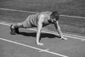 Strong muscles. male strength and power. sportsman in plank. athlete do pushups. train his core muscles. man doing push Royalty Free Stock Photo