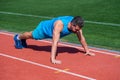 Strong muscles. male strength and power. sportsman in plank. athlete do pushups. train his core muscles. man doing push Royalty Free Stock Photo