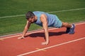 Strong muscles. male strength and power. sportsman in plank. athlete do pushups. train his core muscles. man doing push Royalty Free Stock Photo