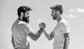 Strong and muscular arms. Successful deal handshake blue sky background. Men shaking hands at meeting. Friendly Royalty Free Stock Photo