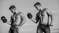 Strong muscular athlete bodybuilder. Attractive twins. Healthy athletic body. Sexy torso attractive body. Masculinity Royalty Free Stock Photo