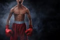 Strong muscular boxer on smoke backgrounds Royalty Free Stock Photo