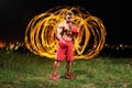 Strong muscular male fighter with fire and flames behind his bac Royalty Free Stock Photo