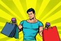 Strong muscular man with bags on sale Royalty Free Stock Photo