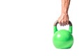 Strong muscular man hand with muscles holding green heavy kettlebell partially isolated on white background Royalty Free Stock Photo