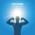 Strong muscular man silhouette at sunshine sunny blue sky