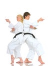 Strong positive young pair of champions karateka Royalty Free Stock Photo