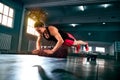 Strong powerful woman doing hard intense workout at gym Royalty Free Stock Photo