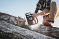 Strong professional lumberman use chainsaw on sawmill Royalty Free Stock Photo