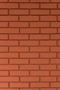 Strong red vertical brick wall background, surface. Red, orange tiles.