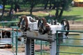 Strong rusted metal gears used to lift and lower metal plate preventing water flow to dam