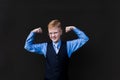 Strong schoolboy on a black background Royalty Free Stock Photo