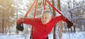 Strong senior man doing bungee fitness exercises, working out outdoors on winter morning, panorama Royalty Free Stock Photo