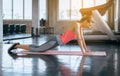 Strong and slim beginner woman doing push up exercises on yoga mat at gym Royalty Free Stock Photo