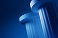 Strong solid pillars supporting sleek corporate structure in blue Royalty Free Stock Photo