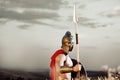 Strong Spartan warrior in battle dress with a shield and a spear Royalty Free Stock Photo