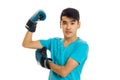 Strong sportsman practicing boxing in blue gloves isolated on white background Royalty Free Stock Photo