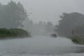 The strong storm with heavy rain on the road with poor visibility of cars Royalty Free Stock Photo