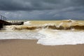 Storm at sea in early September. Berth. Sandy beach Royalty Free Stock Photo