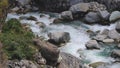 strong stream in deep valley.gurgling pour water.Charming Valley and textured rock