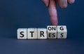 Strong stress symbol. Businessman turns wooden cubes with words `strong stress`. Beautiful grey background, copy space. Business Royalty Free Stock Photo