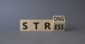 Strong Stress symbol. Turned wooden cubes with words Strong Stress. Beautiful grey background. Business and Strong Stress concept Royalty Free Stock Photo