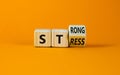 Strong stress symbol. Turned wooden cubes with words `strong stress`. Beautiful orange background, copy space. Business and stro Royalty Free Stock Photo